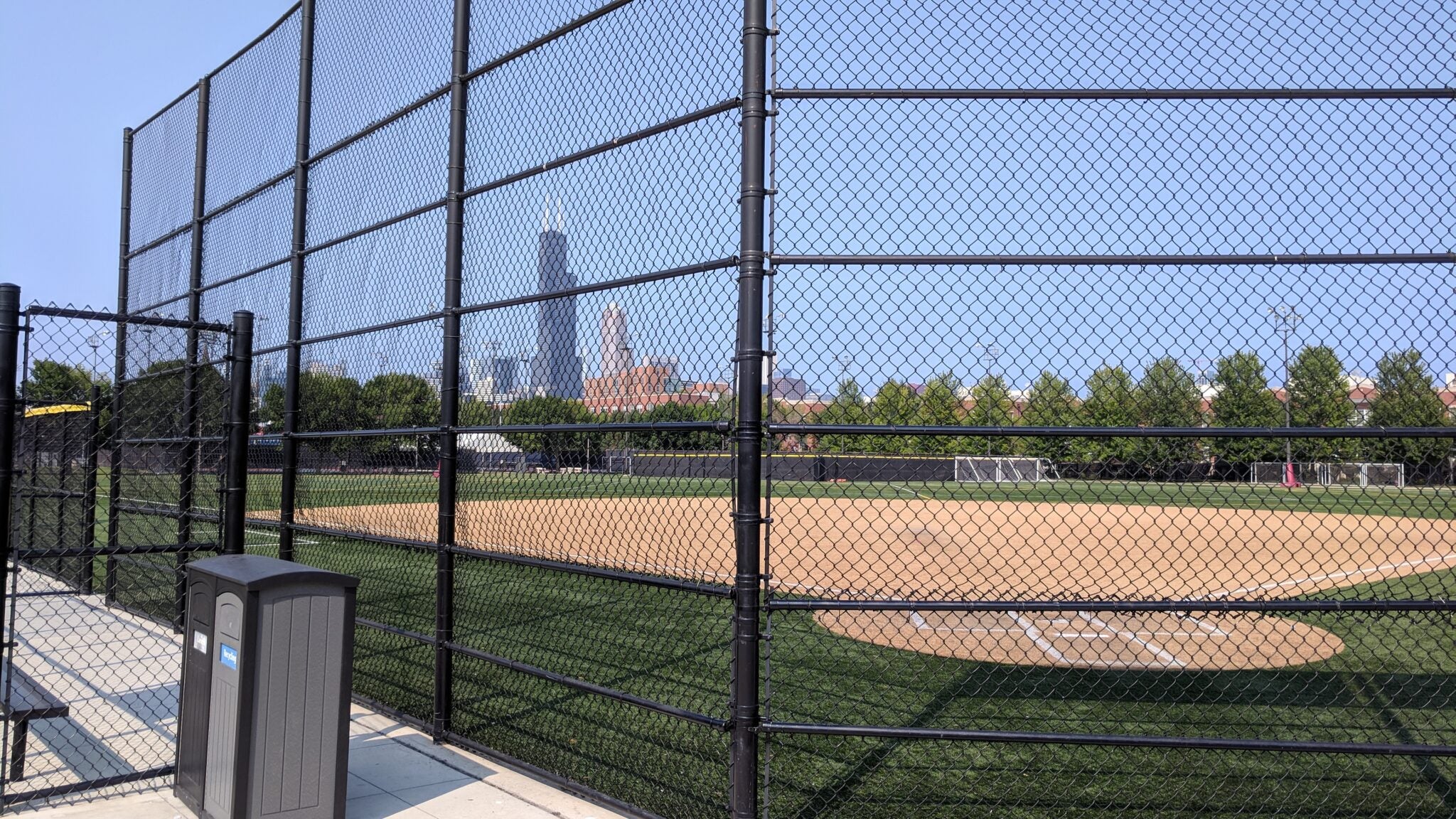 a baseball field enclosed by Wheatland Tube's steel fence framework, treated with ColorCoat